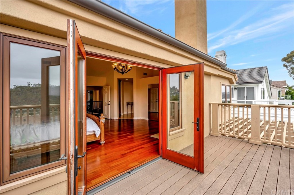 14 Camberley Laguna Niguel, CA 92677 - Photo 52 of 69 a view of a balcony with wooden floor and furniture