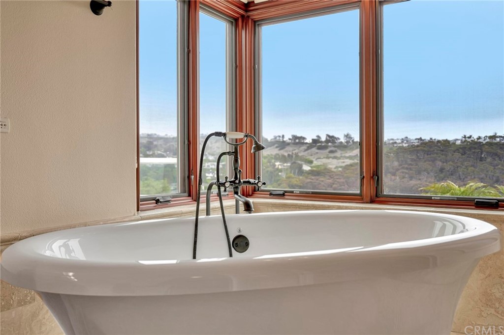 14 Camberley Laguna Niguel, CA 92677 - Photo 61 of 69 a bathroom with a bathtub and next to a window
