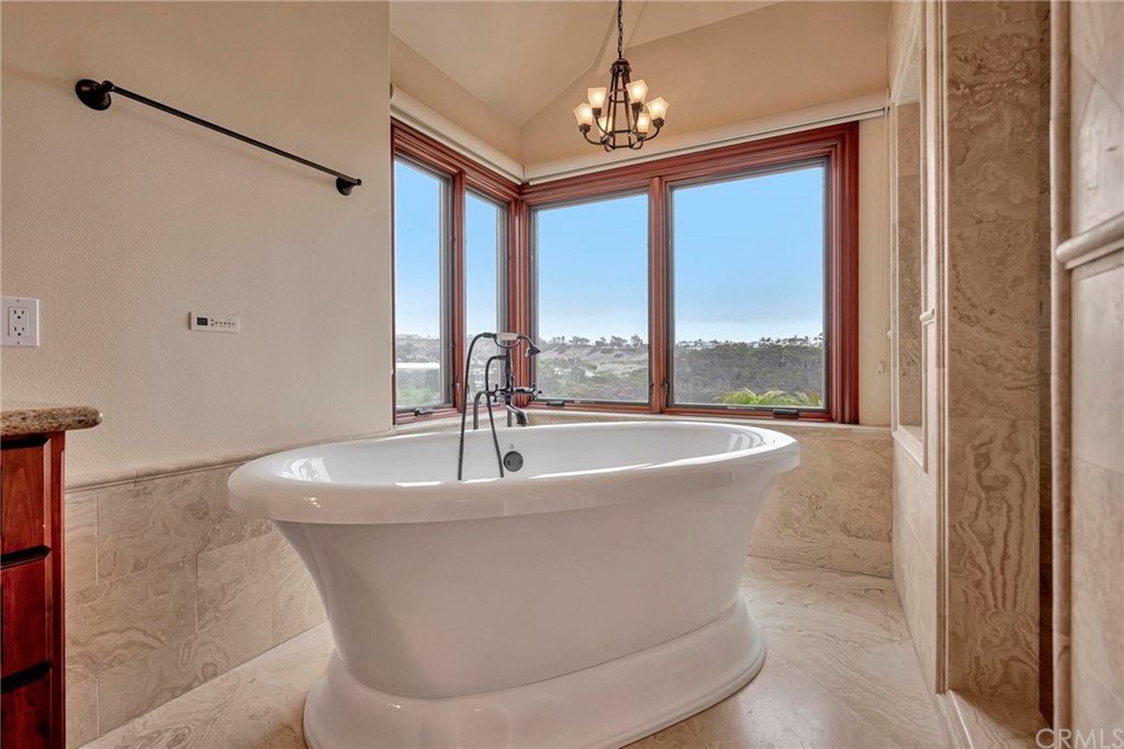 14 Camberley Laguna Niguel, CA 92677 - Photo 69 of 69 a white bath tub sitting in a bathroom next to a window
