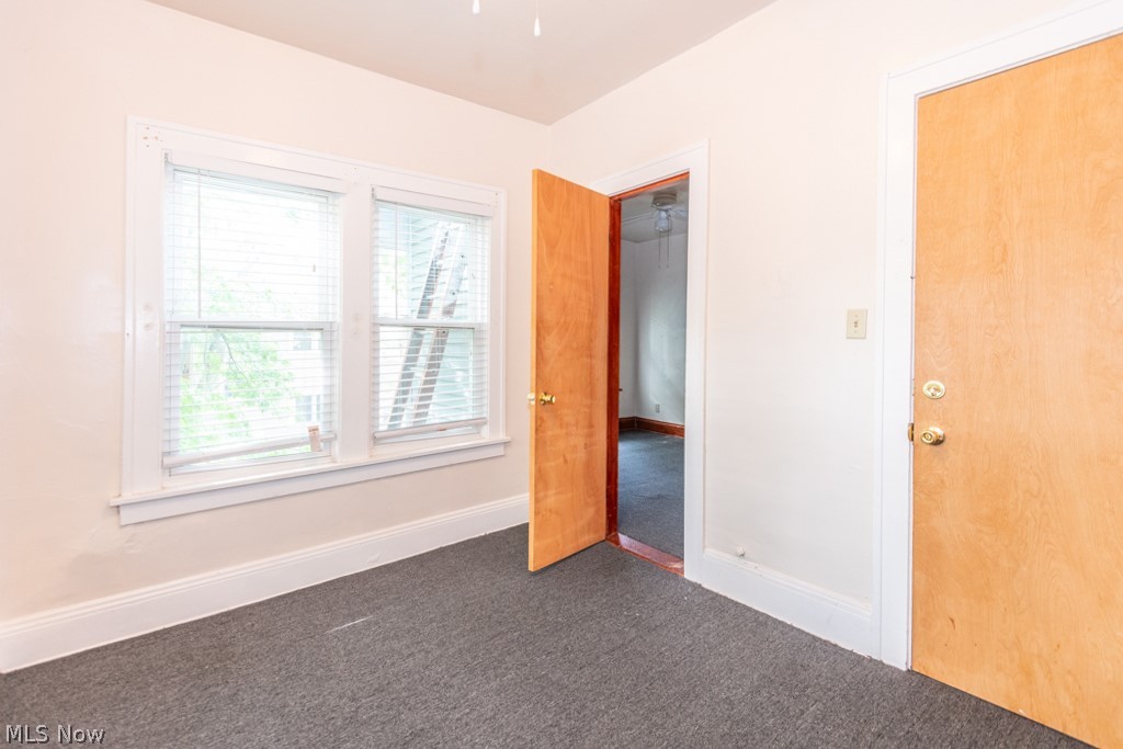 917 Helmsdale Road Cleveland Heights, OH 44112 - Photo 16 of 28 Unfurnished bedroom with dark colored carpet