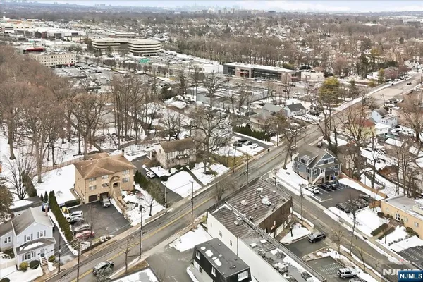 an aerial view of residential building with parking