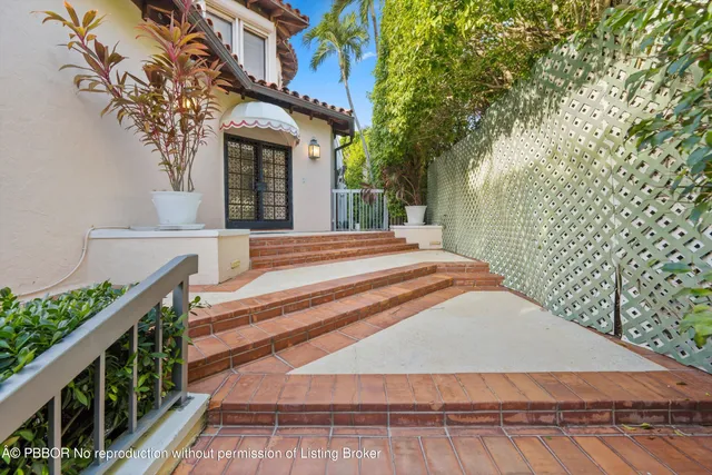 a front view of a house with stairs