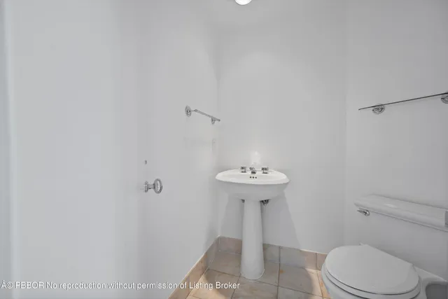 a bathroom with a sink a toilet