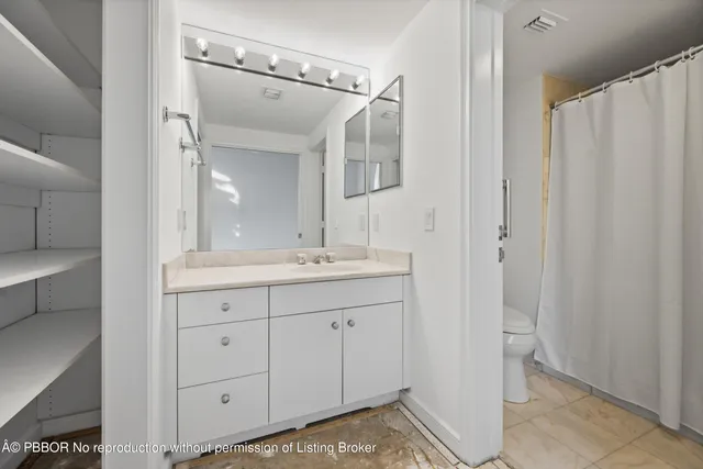 a bathroom with a sink a mirror and a shower