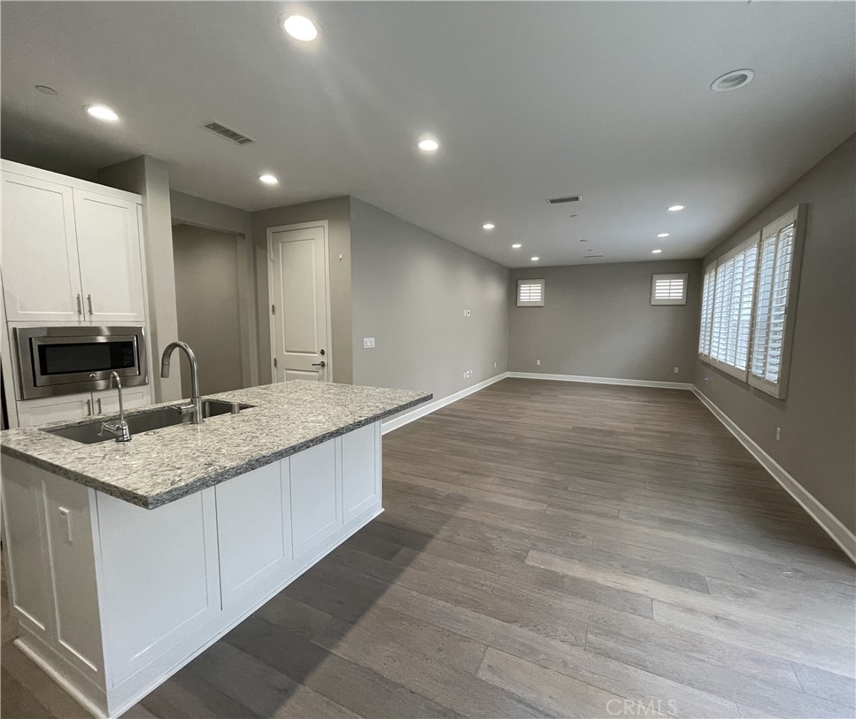 155 Blue Crystal Drive Walnut, CA 91789 - Photo 3 of 10 a bathroom with a granite countertop sink and a large mirror