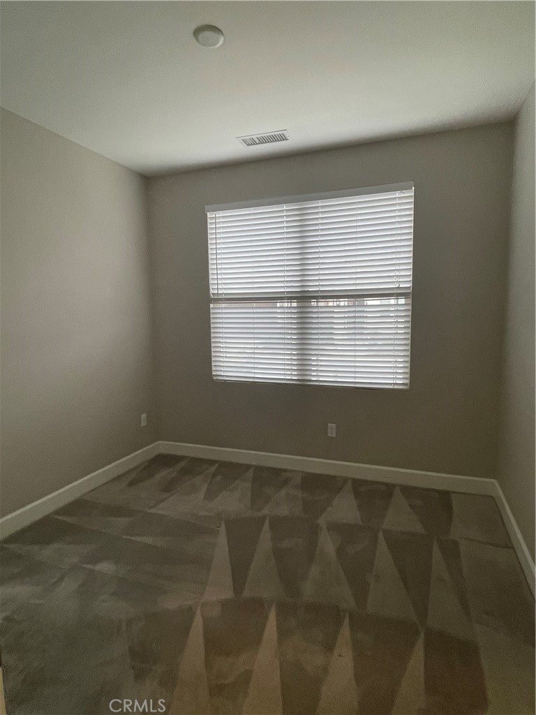 155 Blue Crystal Drive Walnut, CA 91789 - Photo 4 of 10 a view of an empty room with a window