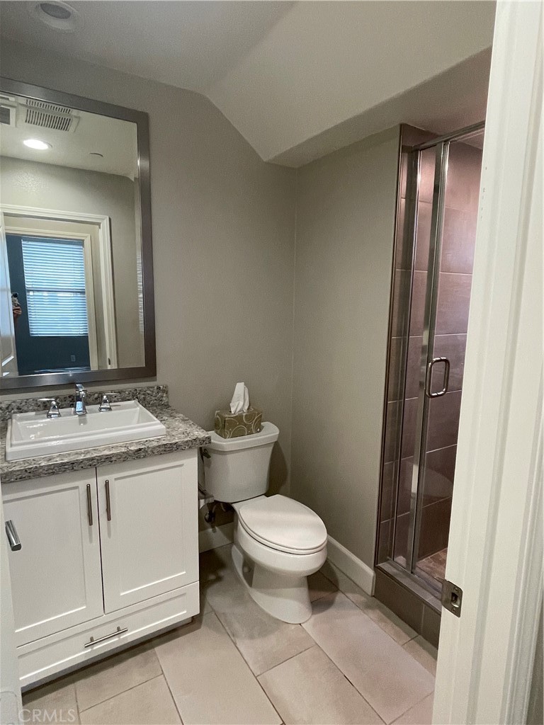 155 Blue Crystal Drive Walnut, CA 91789 - Photo 5 of 10 a bathroom with a granite countertop toilet a sink and a mirror