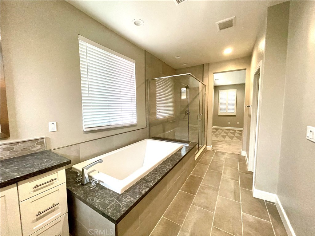 155 Blue Crystal Drive Walnut, CA 91789 - Photo 8 of 10 a bathroom with a granite countertop sink and a bathtub