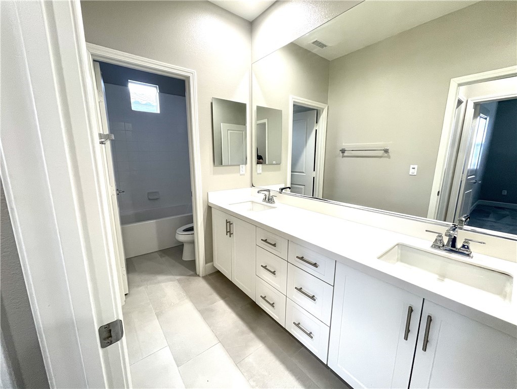 155 Blue Crystal Drive Walnut, CA 91789 - Photo 10 of 10 a spacious bathroom with a double vanity sink mirror and toilet