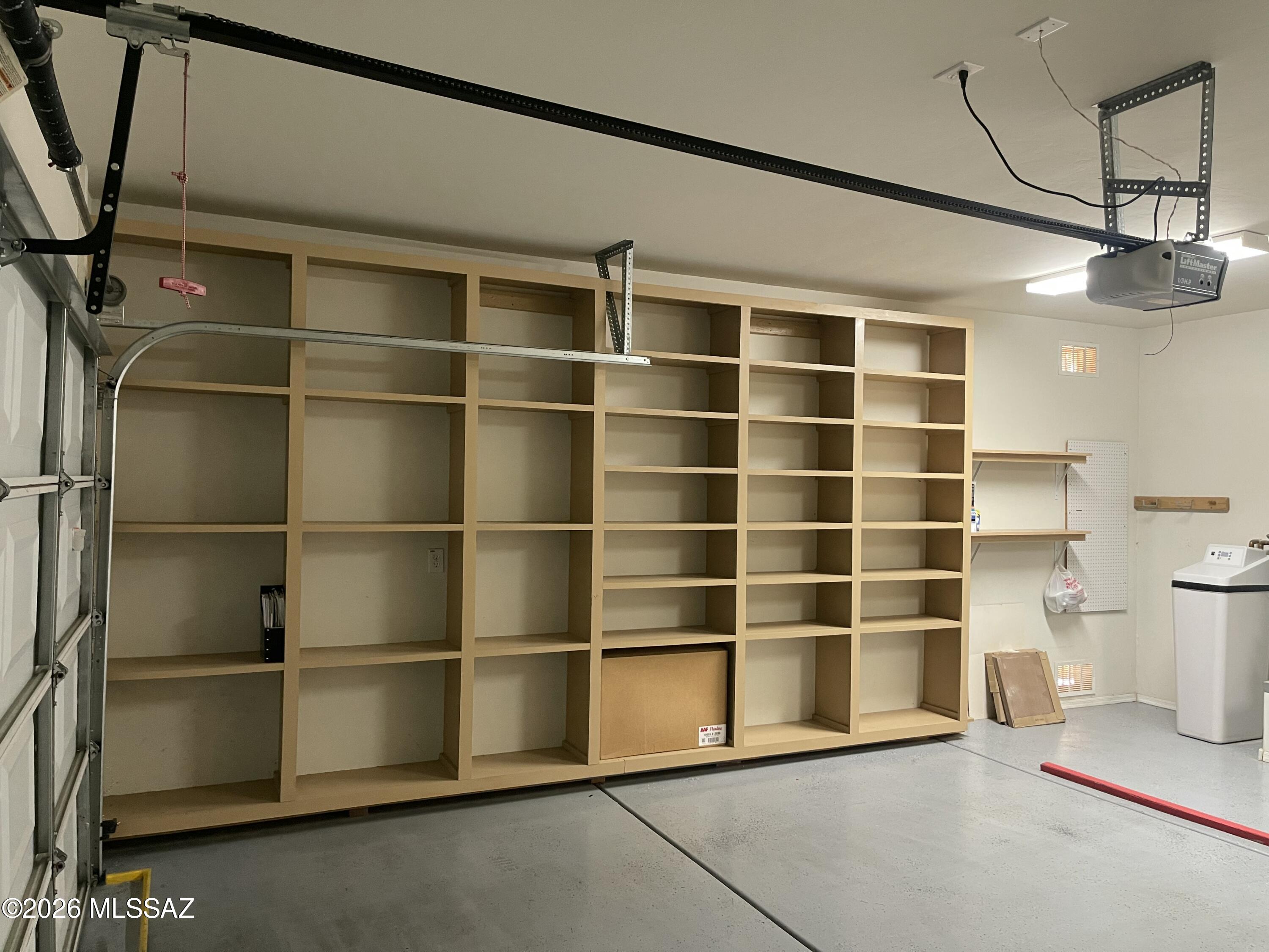 13991 East Cheavront Loop Vail, AZ 85641 - Photo 27 of 47 a view of an empty room with a empty space and empty shelves