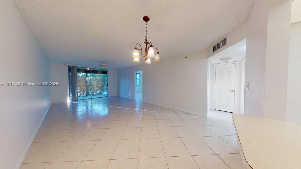 3300 West Rolling Hills Circle, Unit 302 Davie, FL 33328 - Photo 1 of 9 a view of a room with window and wooden floor