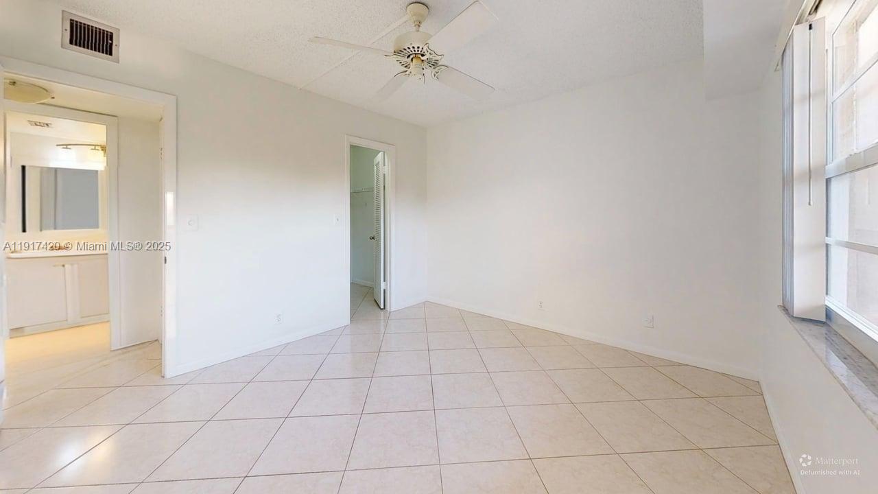 3300 West Rolling Hills Circle, Unit 302 Davie, FL 33328 - Photo 8 of 9 an empty room with windows