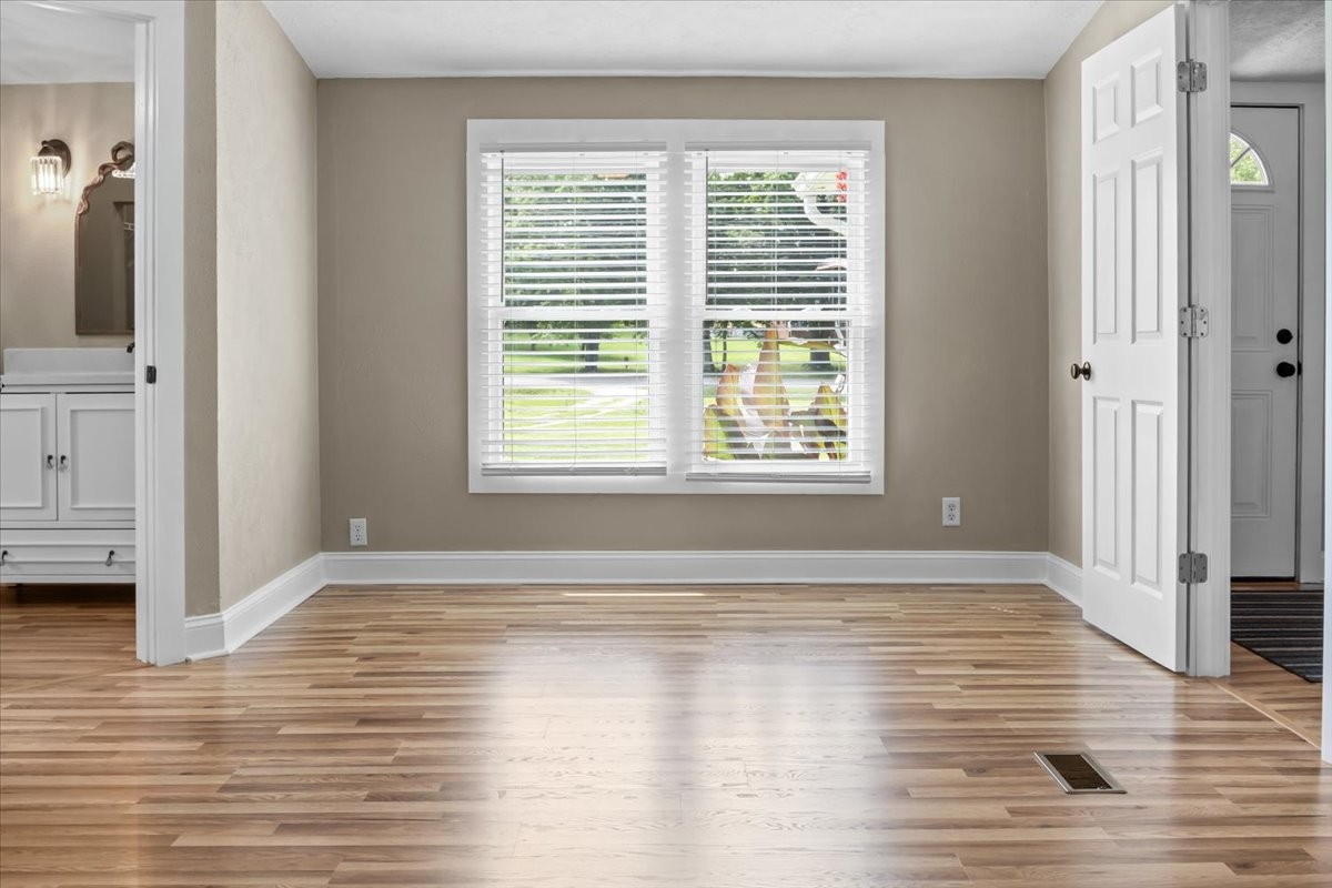 1112 Garners Creek Road Dickson, TN 37055 - Photo 25 of 57 a view of an empty room with wooden floor and a window