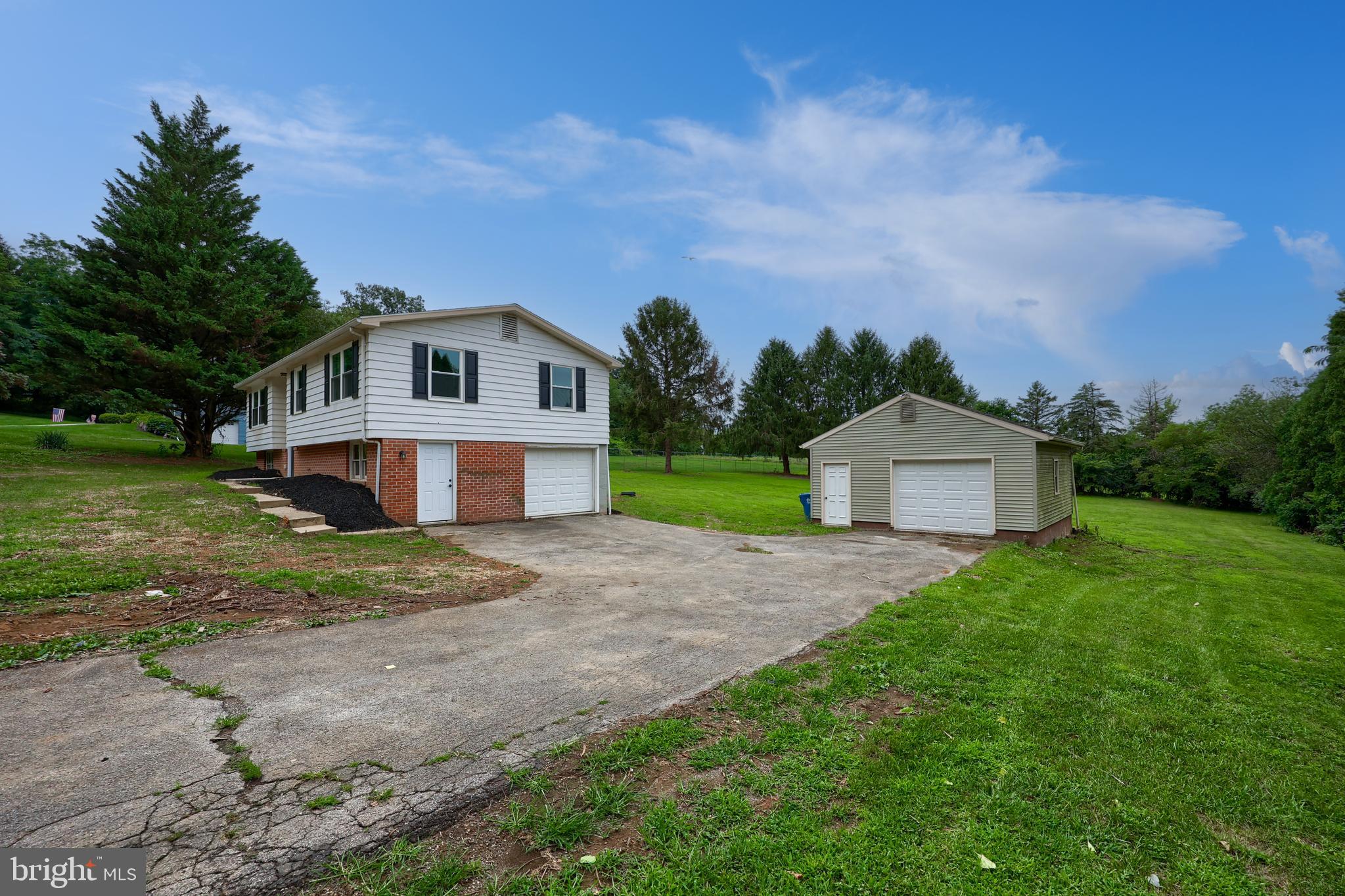 2208 Keeney Road Spring Grove, PA 17362 - Photo 2 of 64 a front view of a house with a yard and garage