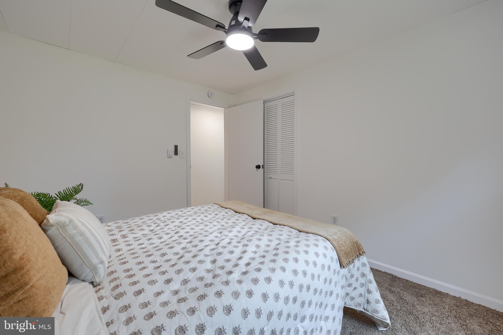 2208 Keeney Road Spring Grove, PA 17362 - Photo 29 of 64 a bedroom with a bed and a chandelier