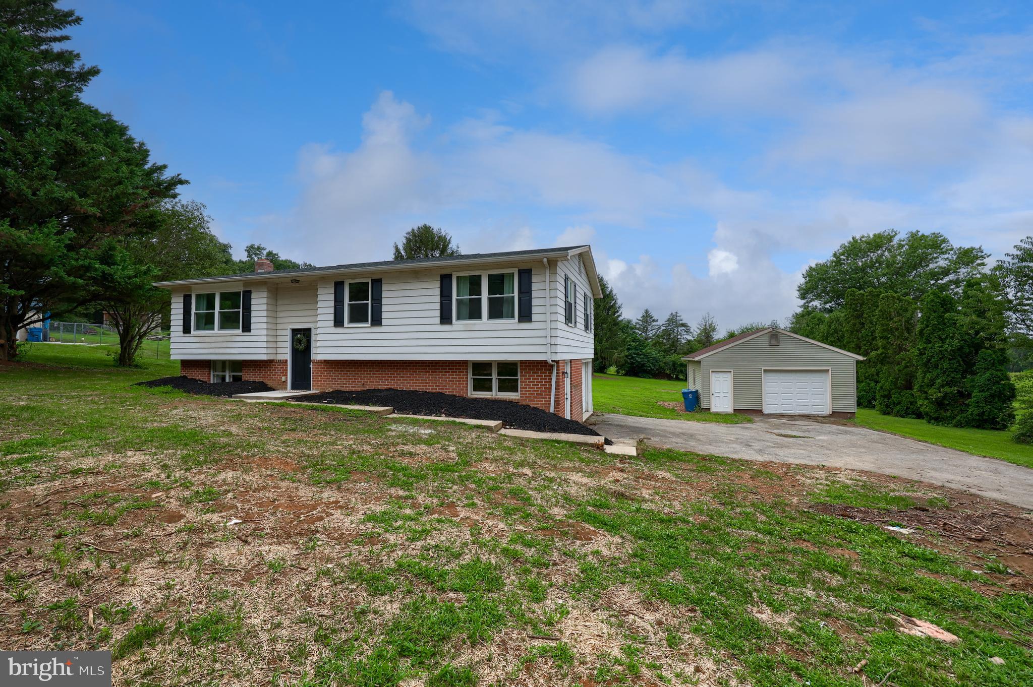 2208 Keeney Road Spring Grove, PA 17362 - Photo 49 of 64 a front view of a house with a garden