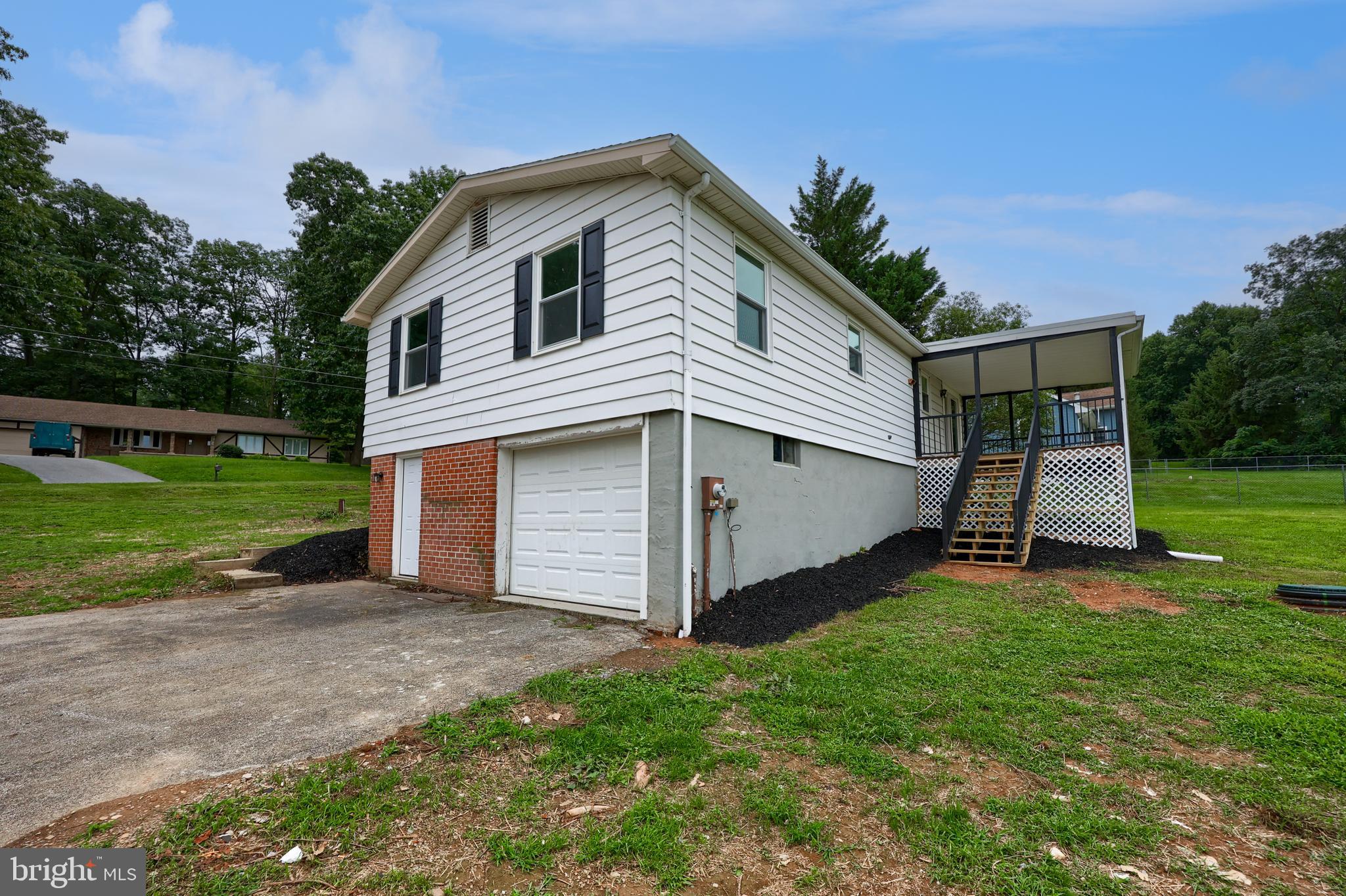 2208 Keeney Road Spring Grove, PA 17362 - Photo 50 of 64 a front view of a house with a yard and garage