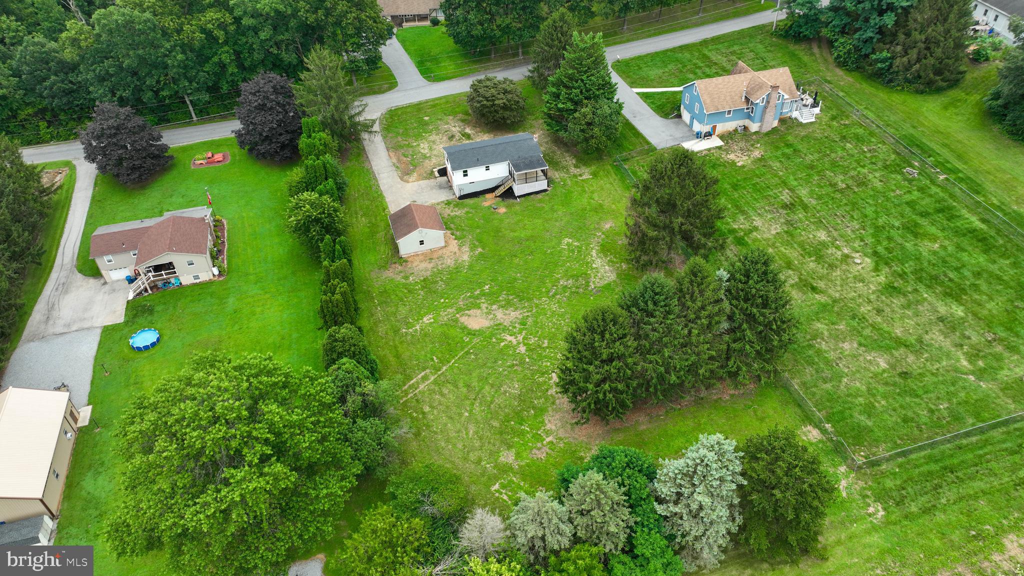 2208 Keeney Road Spring Grove, PA 17362 - Photo 54 of 64 an aerial view of residential house with outdoor space and trees all around