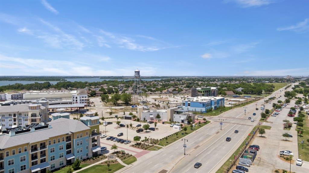 1112 Hitching Post Way Oak Point, TX 75068 - Photo 7 of 9 a view of a city with tall buildings