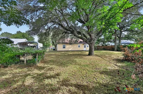 a view of outdoor space with deck and yard