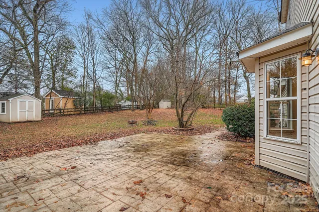 a view of a yard with a house and snow