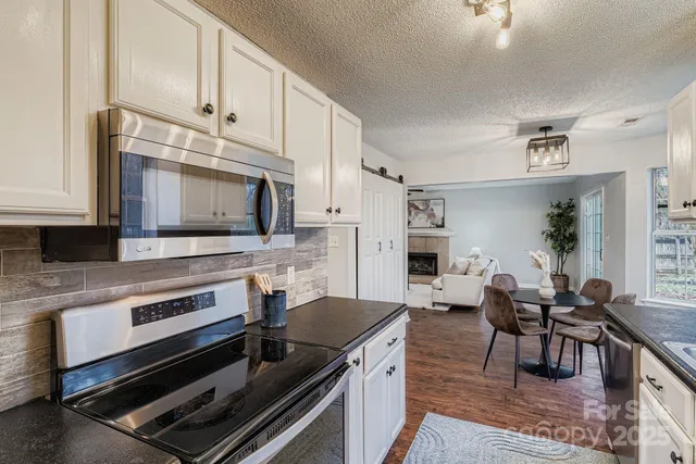 a kitchen with a stove and a microwave