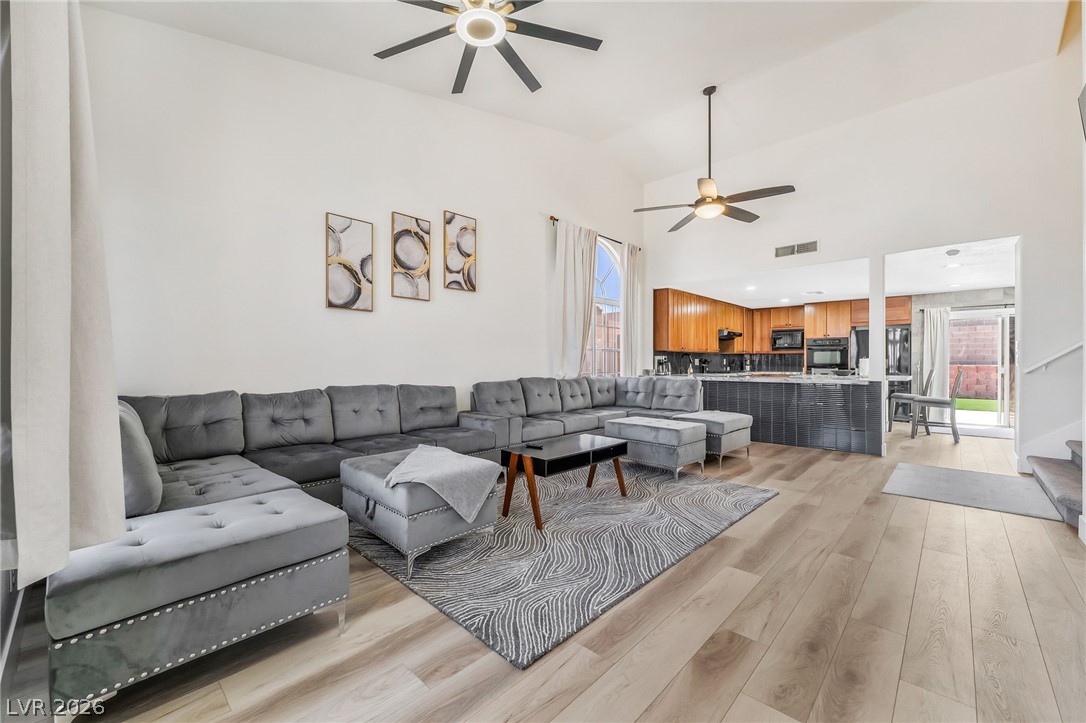 104 Appian Way Henderson, NV 89002 - Photo 24 of 24 An open floorplan seamlessly connects the airy living space to a well-appointed kitchen.