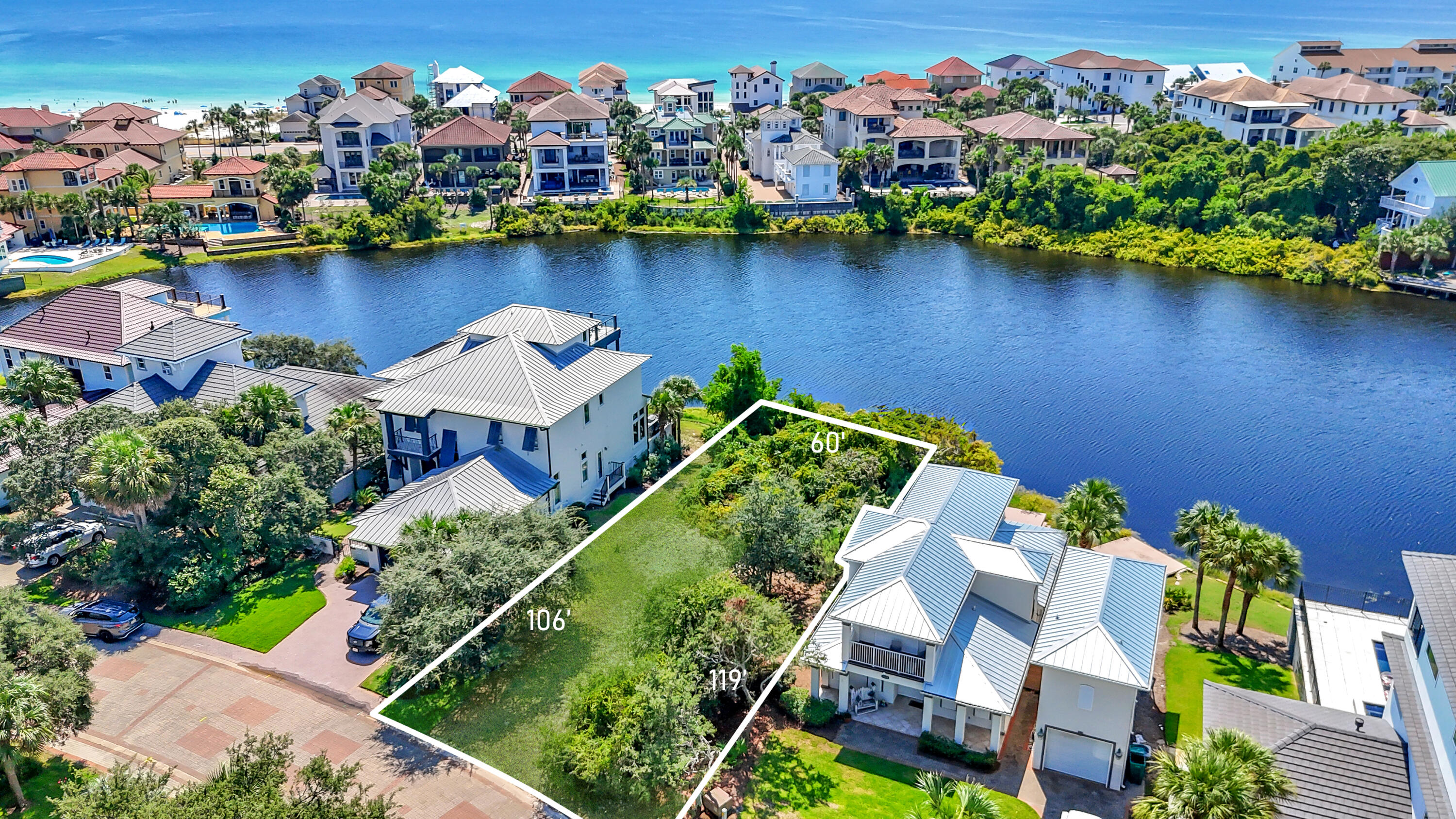 4630 Sunset Pointe Destin, FL 32541 - Photo 2 of 4 an aerial view of a house with a lake view