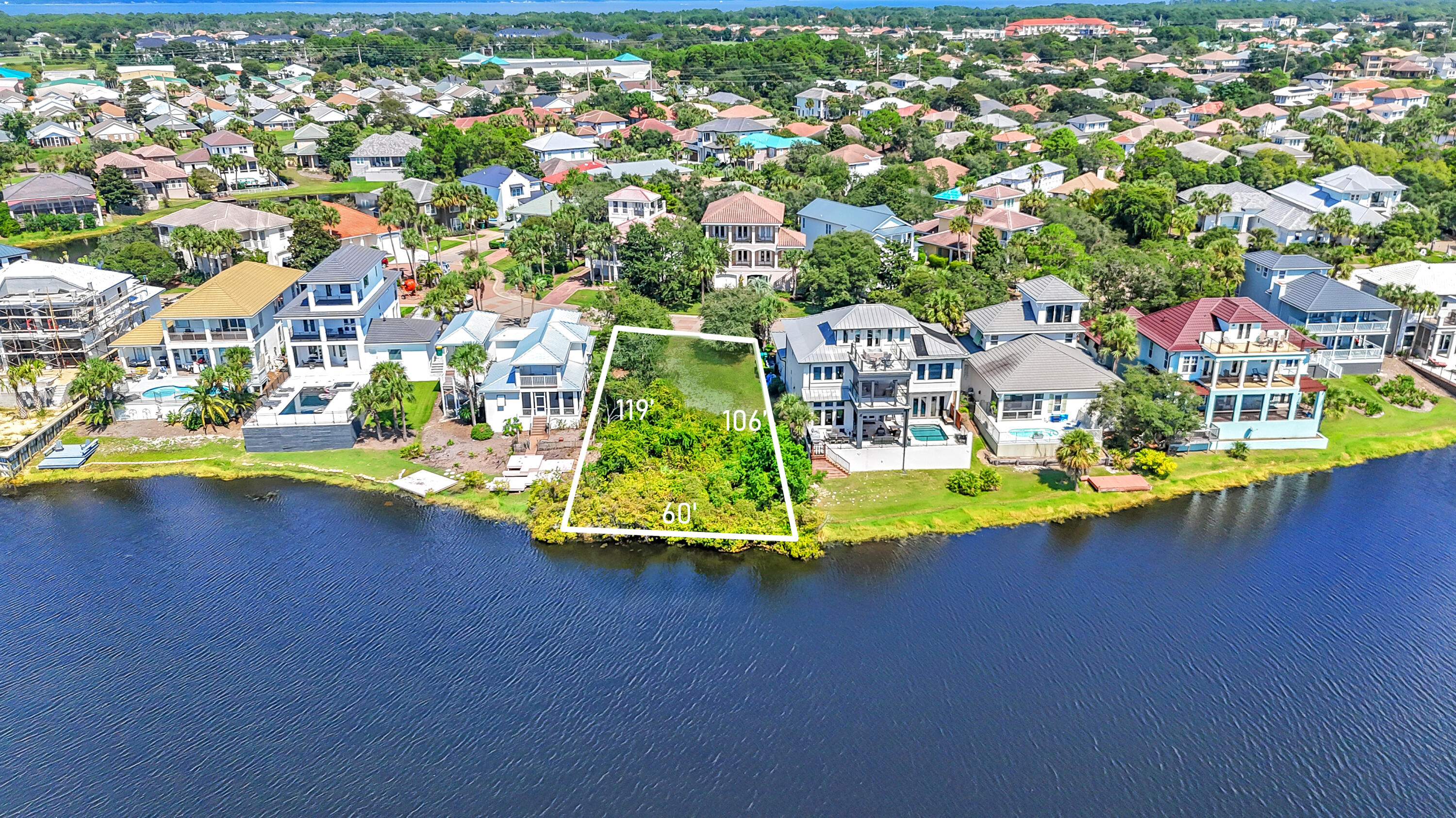 4630 Sunset Pointe Destin, FL 32541 - Photo 3 of 4 an aerial view of a house with a garden and lake view