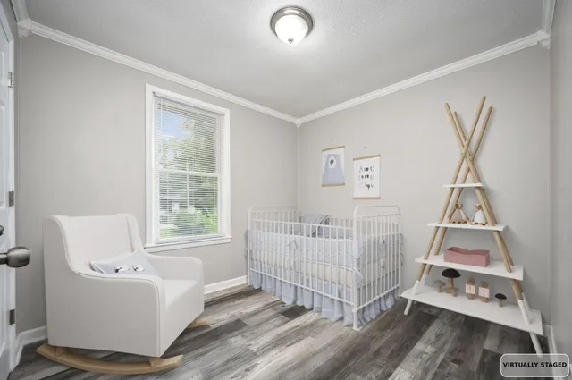 a bedroom with furniture and a window