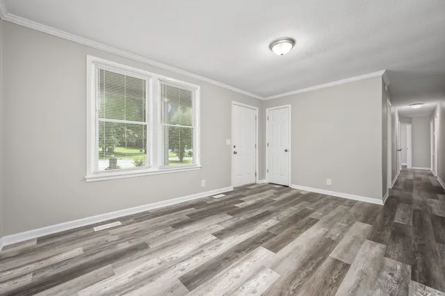 a view of an empty room with a window