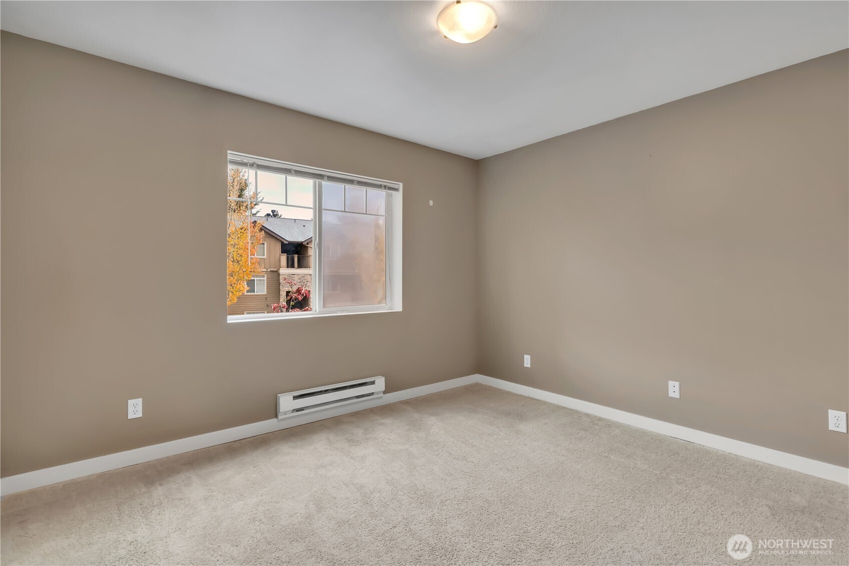 18930 Bothell Everett Highway, Unit B304 Bothell, WA 98012 - Photo 20 of 35 an empty room with windows