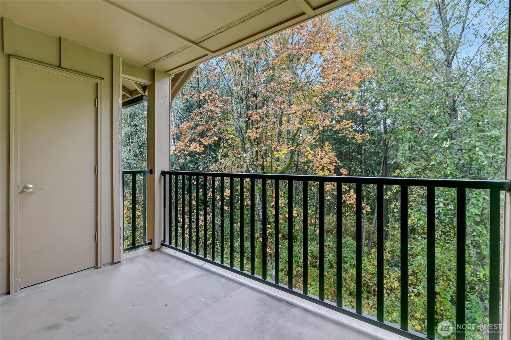18930 Bothell Everett Highway, Unit B304 Bothell, WA 98012 - Photo 23 of 35 a balcony with trees in front of it
