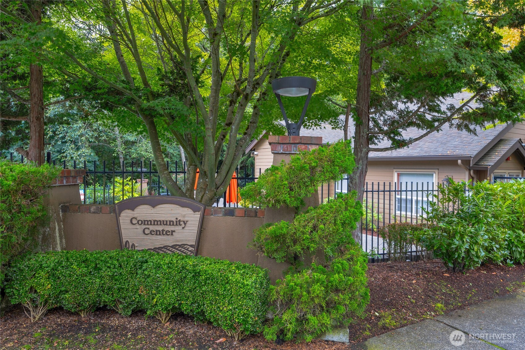18930 Bothell Everett Highway, Unit B304 Bothell, WA 98012 - Photo 27 of 35 a view of a house with a garden and plants