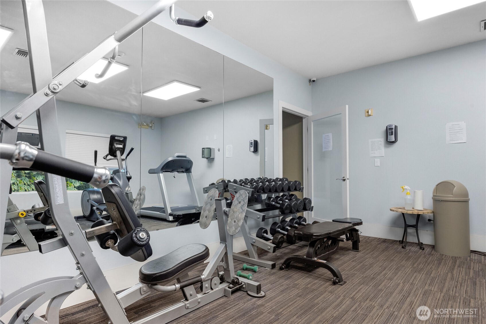 18930 Bothell Everett Highway, Unit B304 Bothell, WA 98012 - Photo 28 of 35 a room with gym equipment and wooden floor
