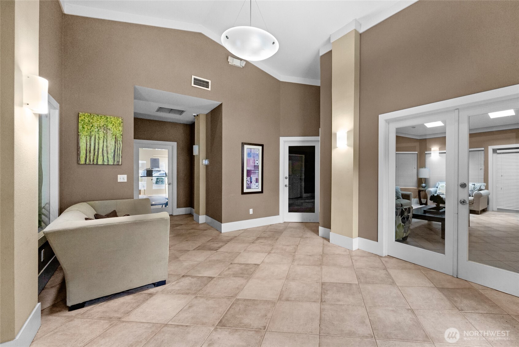 18930 Bothell Everett Highway, Unit B304 Bothell, WA 98012 - Photo 29 of 35 a living room with furniture and a dining table