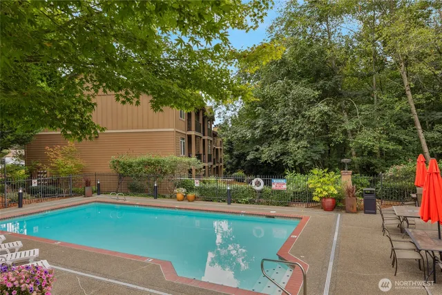 a view of patio with a table and chairs