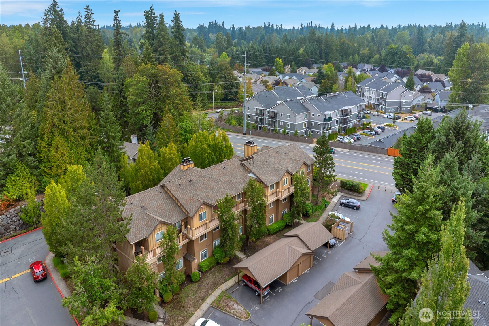 18930 Bothell Everett Highway, Unit B304 Bothell, WA 98012 - Photo 35 of 35 an aerial view of multiple houses with yard