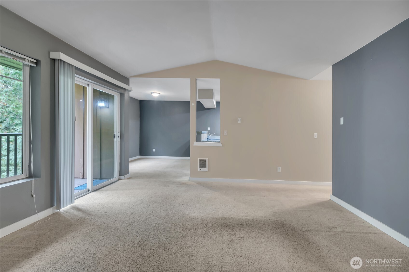 18930 Bothell Everett Highway, Unit B304 Bothell, WA 98012 - Photo 5 of 35 a view of an empty room with a fireplace