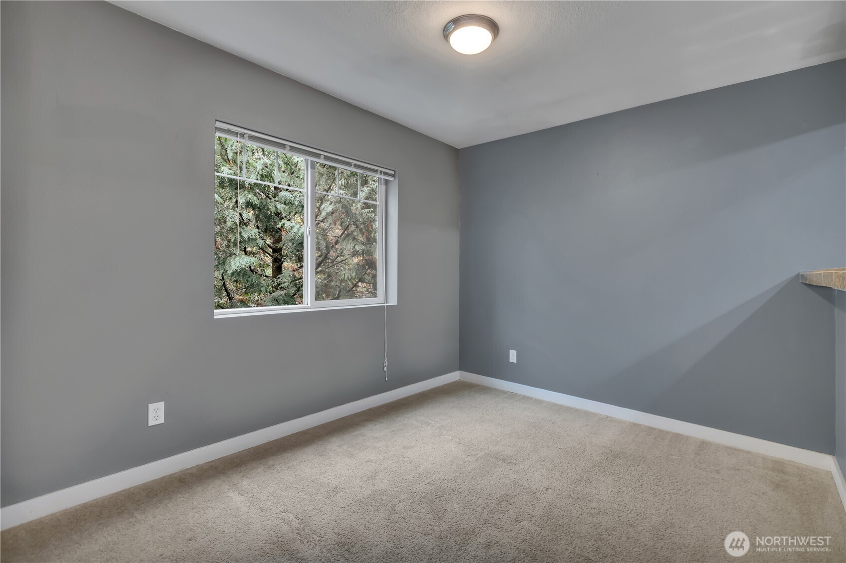 18930 Bothell Everett Highway, Unit B304 Bothell, WA 98012 - Photo 9 of 35 an empty room with a window