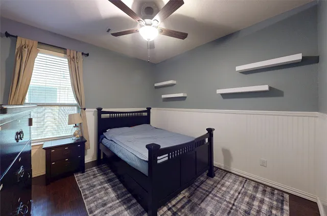 a bedroom with a bed and window