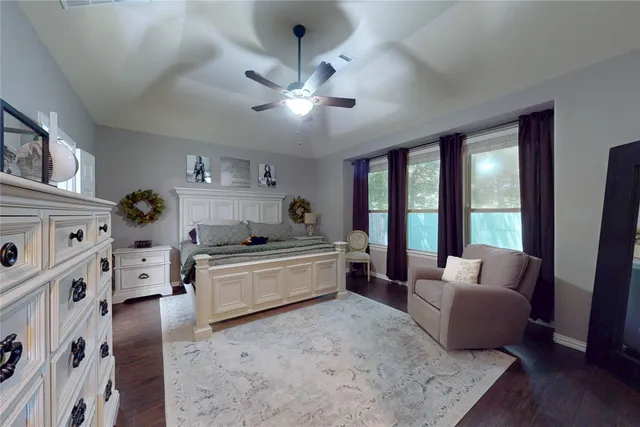 a large white room with furniture and a large window