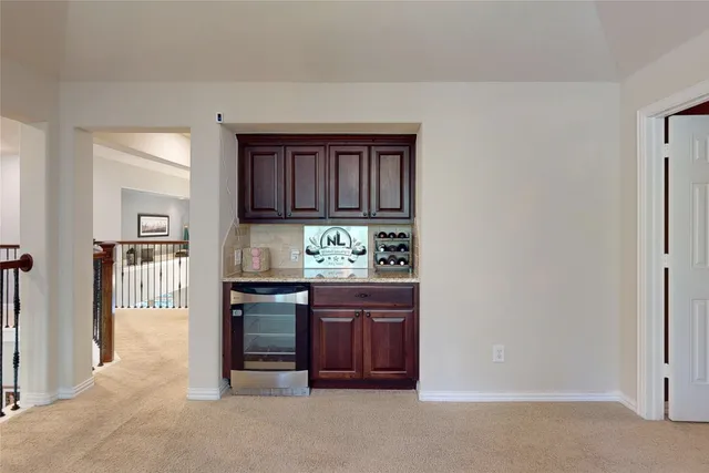 a kitchen with granite countertop a stove and cabinets