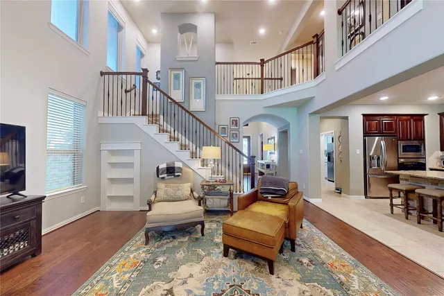 a living room with furniture or stairs and a wooden floor