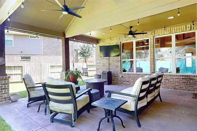 a outdoor dining space with furniture and outdoor view