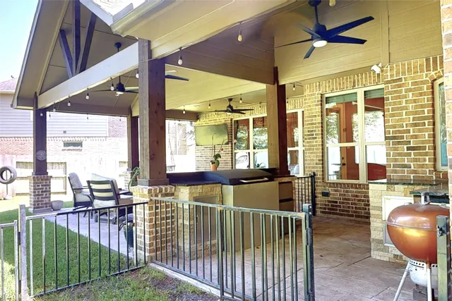 a view of a house with swimming pool and porch