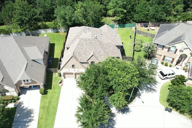 an aerial view of a house with a swimming pool yard and outdoor seating