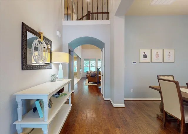 a view of a livingroom with furniture and hardwood floor