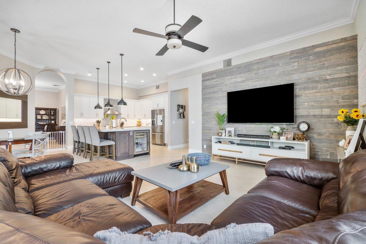 21432 Crestfalls Court Boca Raton, FL 33428 - Photo 13 of 31 a living room with furniture kitchen view and a flat screen tv