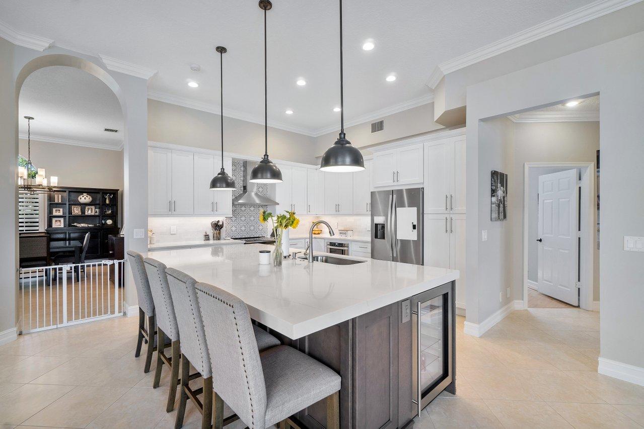 21432 Crestfalls Court Boca Raton, FL 33428 - Photo 14 of 31 a kitchen with a table and chairs